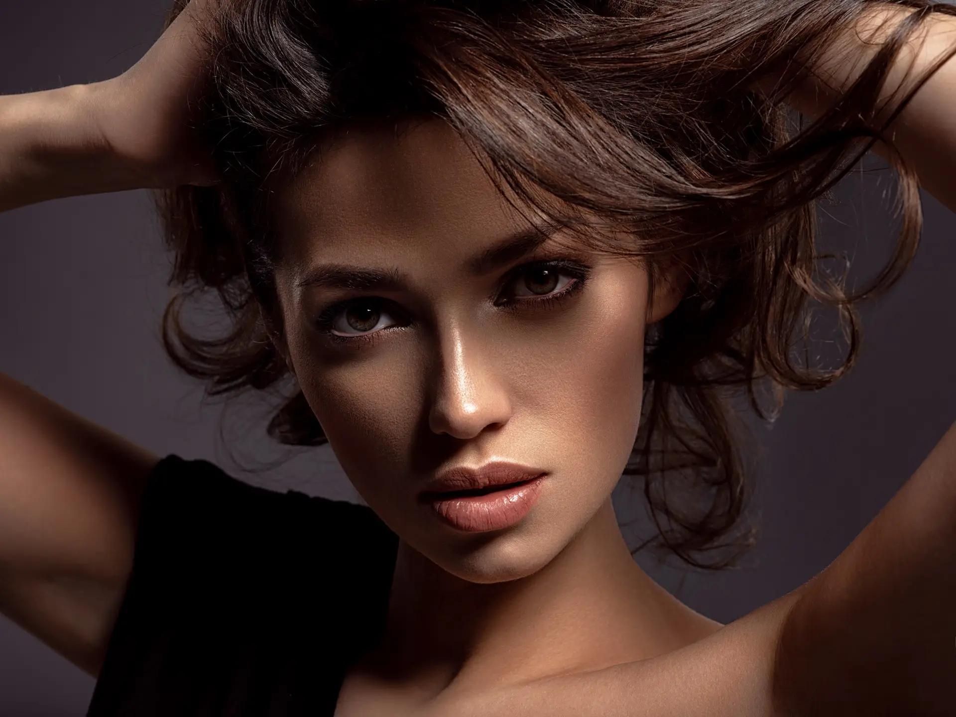 Beautiful woman with brown hair. Attractive model with brown eyes.